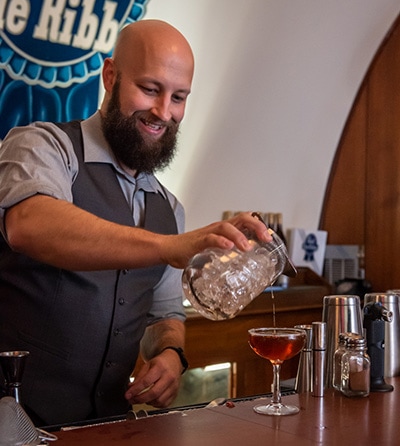 Our mixologist Dustin Crawford mixes a Blackberry Velvet