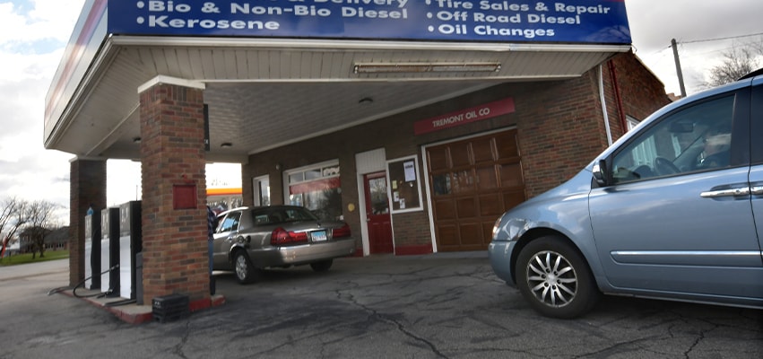 Tom Gibson, the third Generation, pumps gas