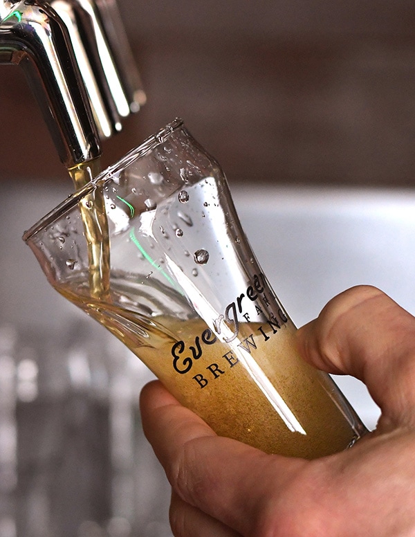 Beer pouring from tap into a glass