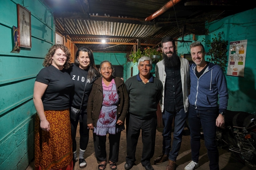 Banu and Mike Hatfield with Zion staff and a coffee farmer family on a visit to Guatemala