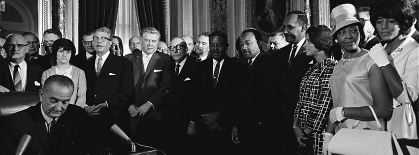 President Lyndon B. Johnson signs the Voting Rights Act of 1965