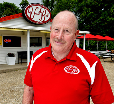 Bob Bally standing in front of ice cream shop