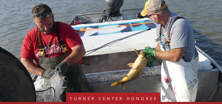 Turner Center Nominee: Men in boat catch Asian Carp