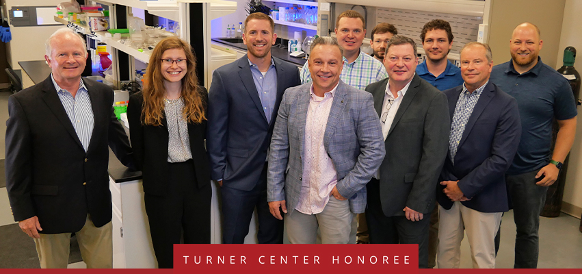 Turner Center Nominee: A group posing for a photo in a lab.