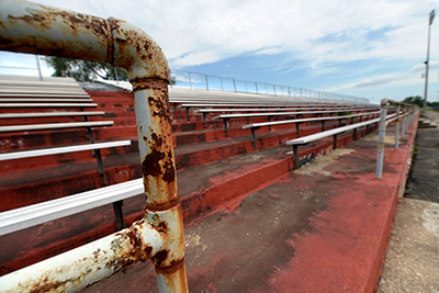 The rusted deuterating visitors bleachers