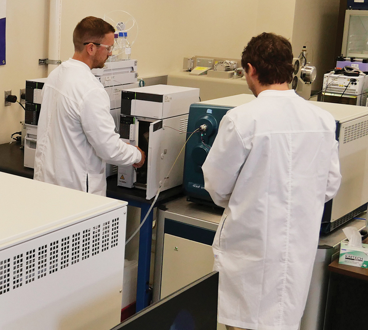 Lab technicians working with lab equipment