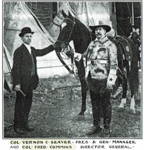 Vintage Photo of two men and a horse standing in front of a few tee pees