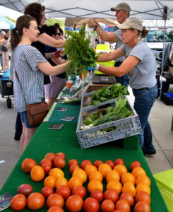 Customers purchasing produce at the Farmers Market