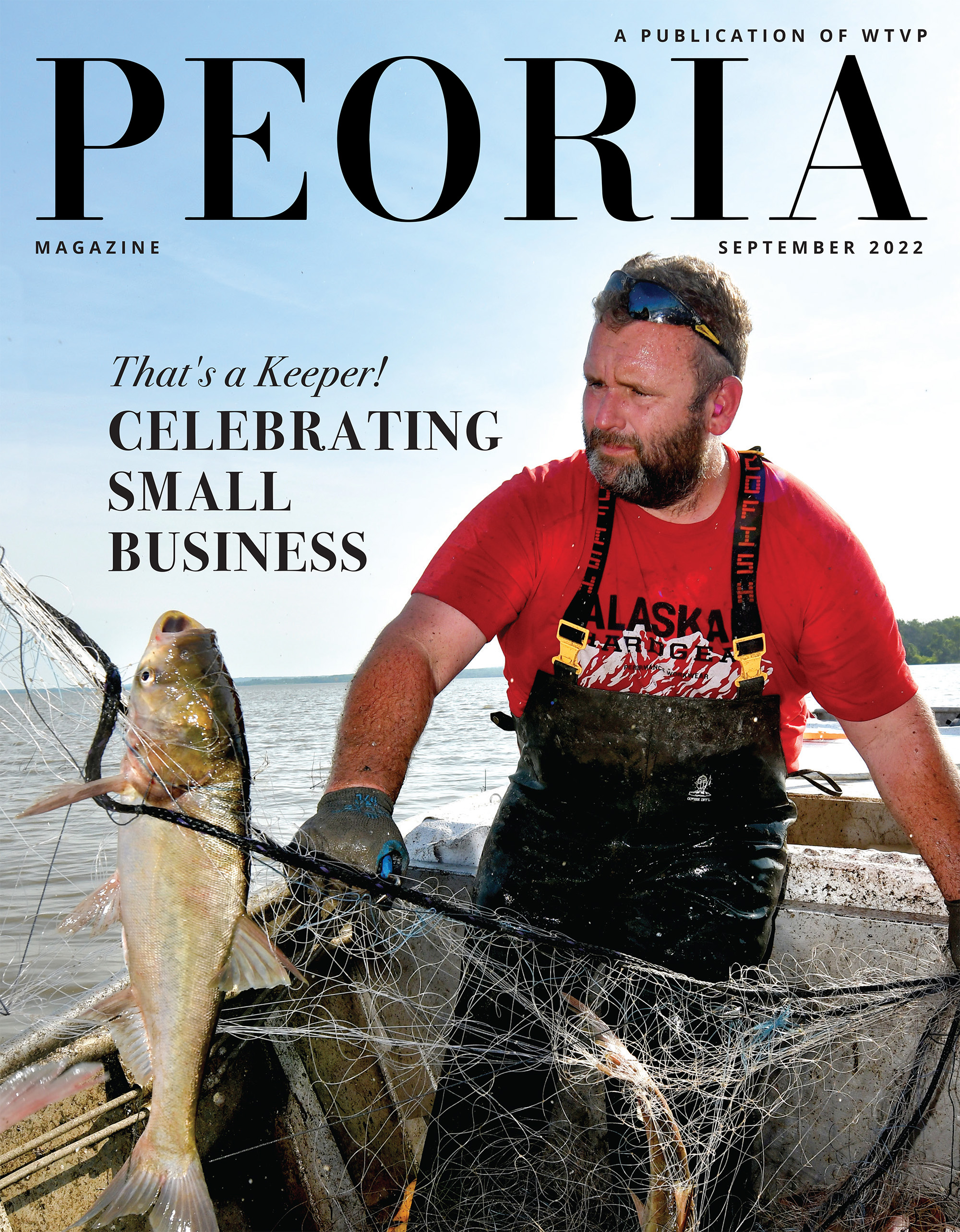 Cover of the September 2022 Peoria Magazine - Photo of a fisherman with a large Asian Carp in a fishing net.