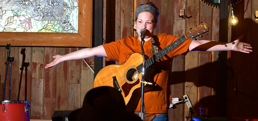 Sarah Marie Dillard performs during open mic at the Red Barn in Peoria
