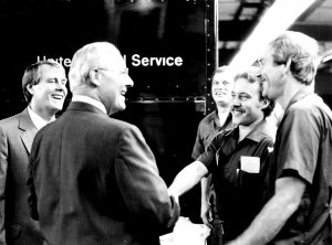 U.S. Rep. Bob Michel shakes hands ahead of a meeting with UPS workers in this candid photograph from the late 1980s or early 1990s
