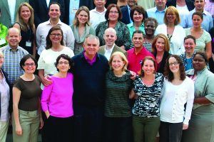 Ray LaHood poses with attendees at a leadership forum at the U.S. Department of Transportation in 2010