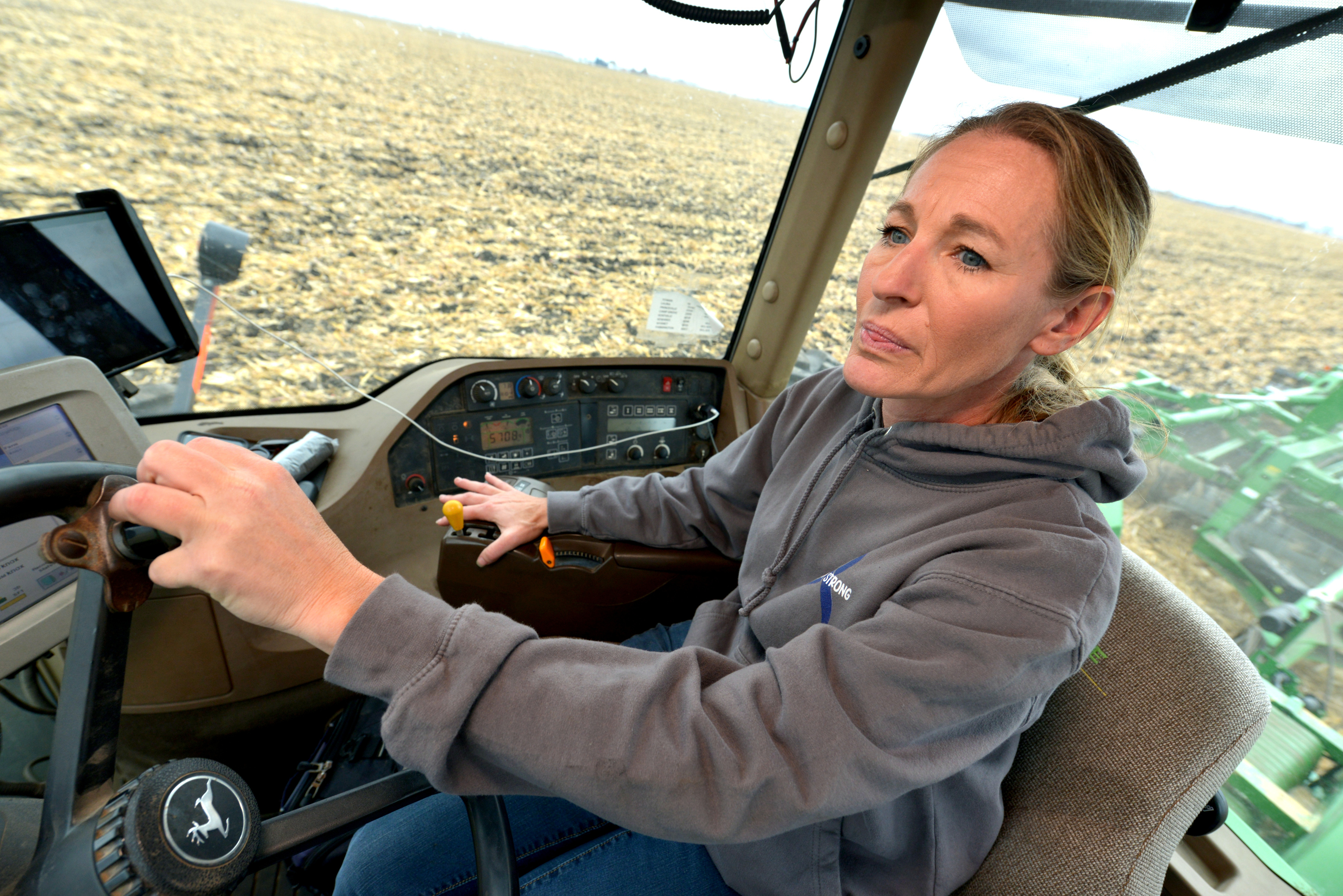 Cheryl Walsh of Bradford, discs a harvested corn field