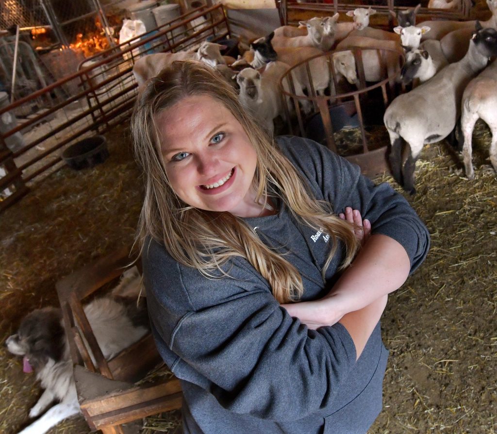 Ali Gibbs tends to the livestock on the land she farms with husband Nathan