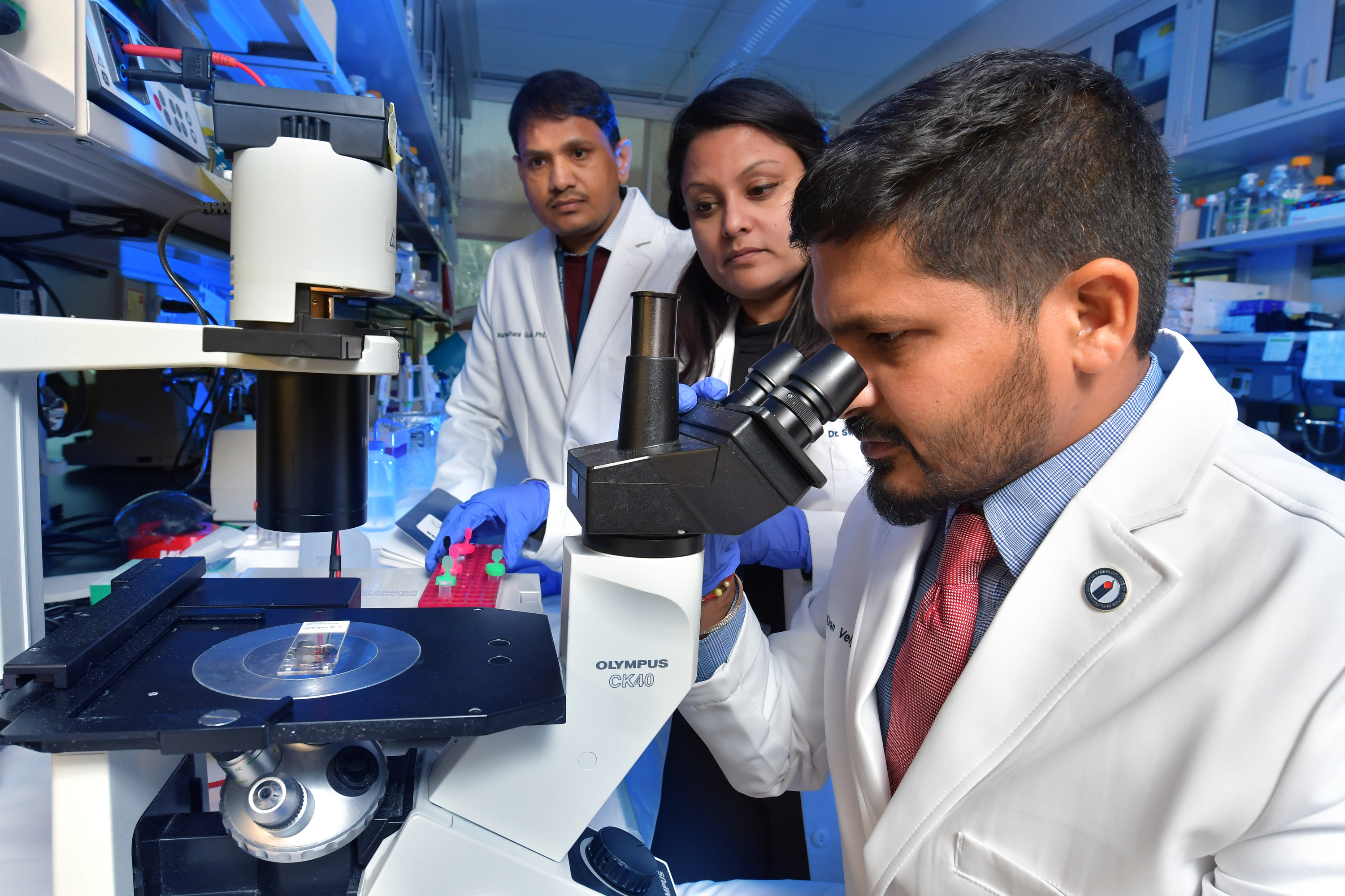 Dr. Kiran Velpula of the University of Illinois College of Medicine Peoria performs research on glioblastomas. Assisting him are Dr. Maheedhara Guda, left, research specialist, and Dr. Swapna Asuthkar, assistant professor.