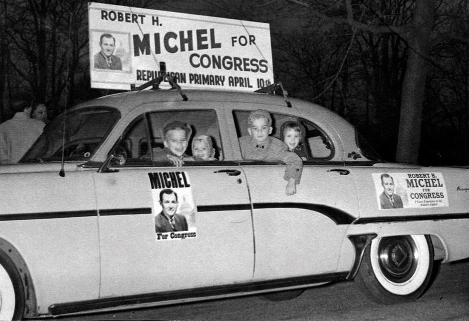 Family members crowd into the official campaign car during Bob Michel's first campaign for Congress in 1956