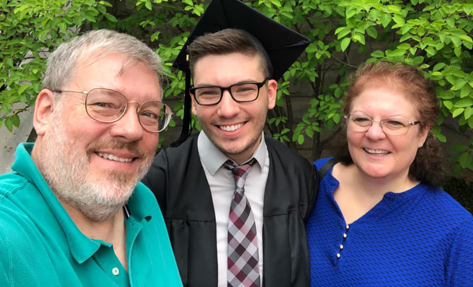 Adam with his parents, Roger and Kathy Kujawa