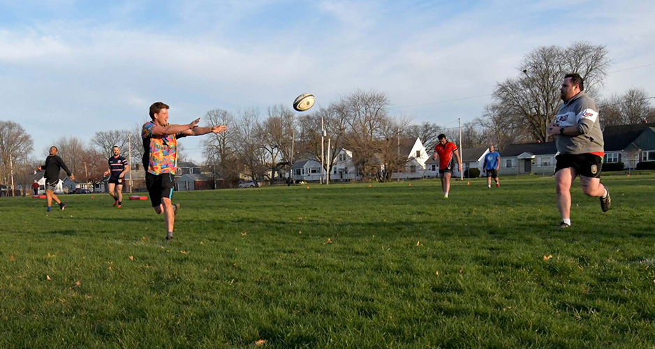Members of the Peoria Piggies men's rugby club practice at Catholic Charities Field