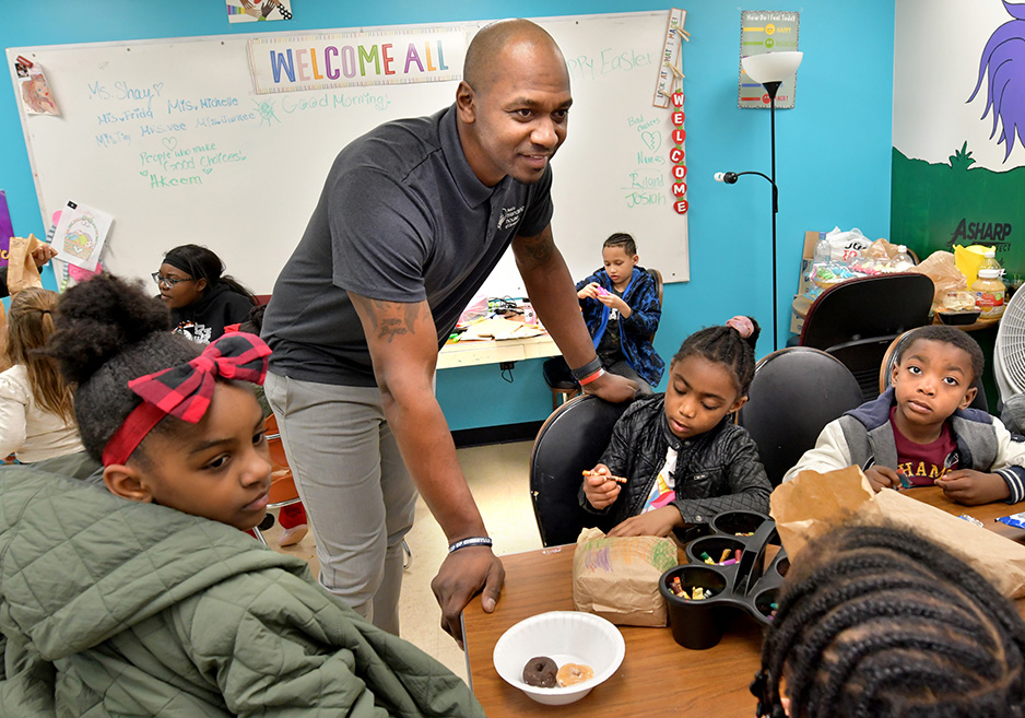 Marcellus Sommerville, president and CEO, interacts with the children who visit Peoria Friendship House