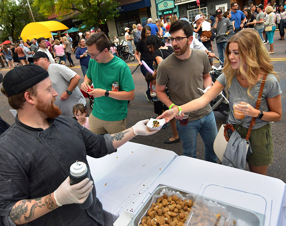 Chef Joe Gresham of Joe’s Original Italian and Martini Bar serves customers lined up at Taste of the Heights