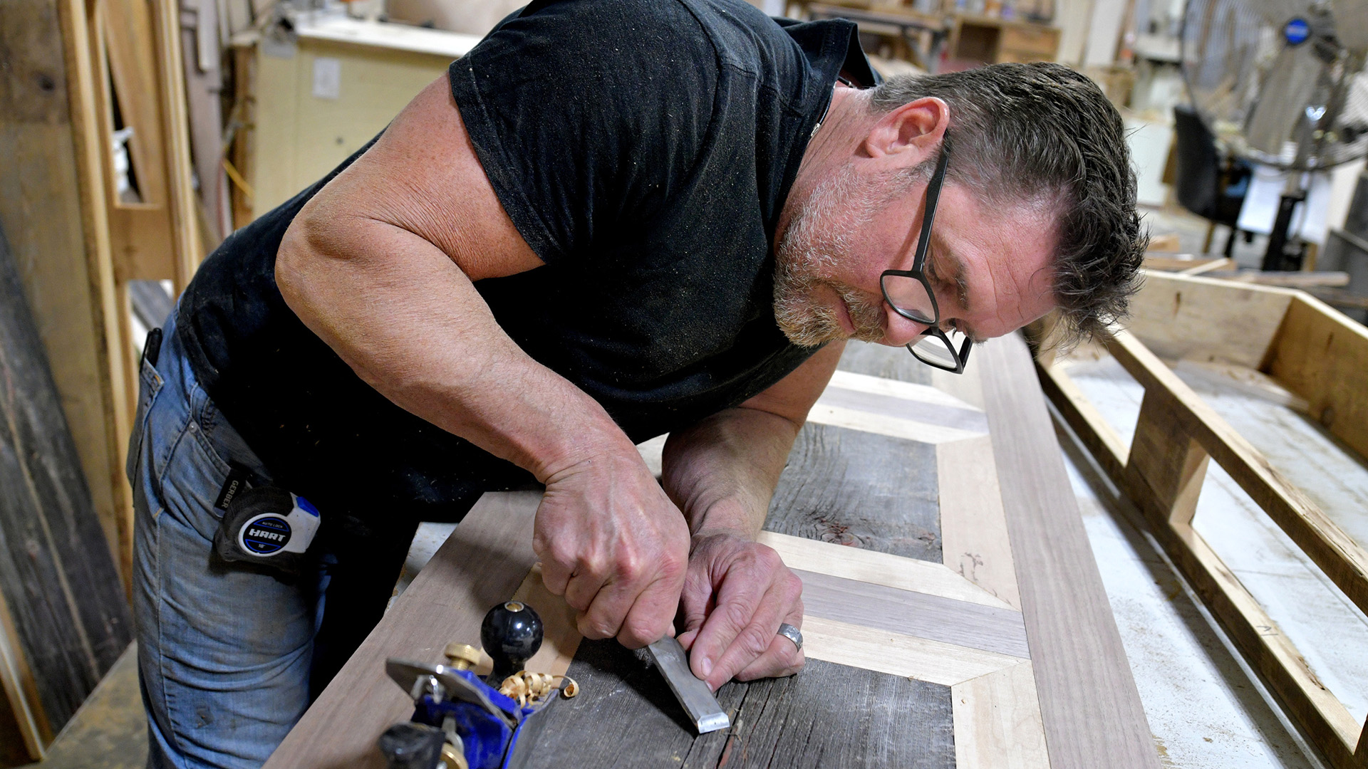 Green Gables furniture designer Tim McClellan works on a piece at the Green Gables factory in Bradford