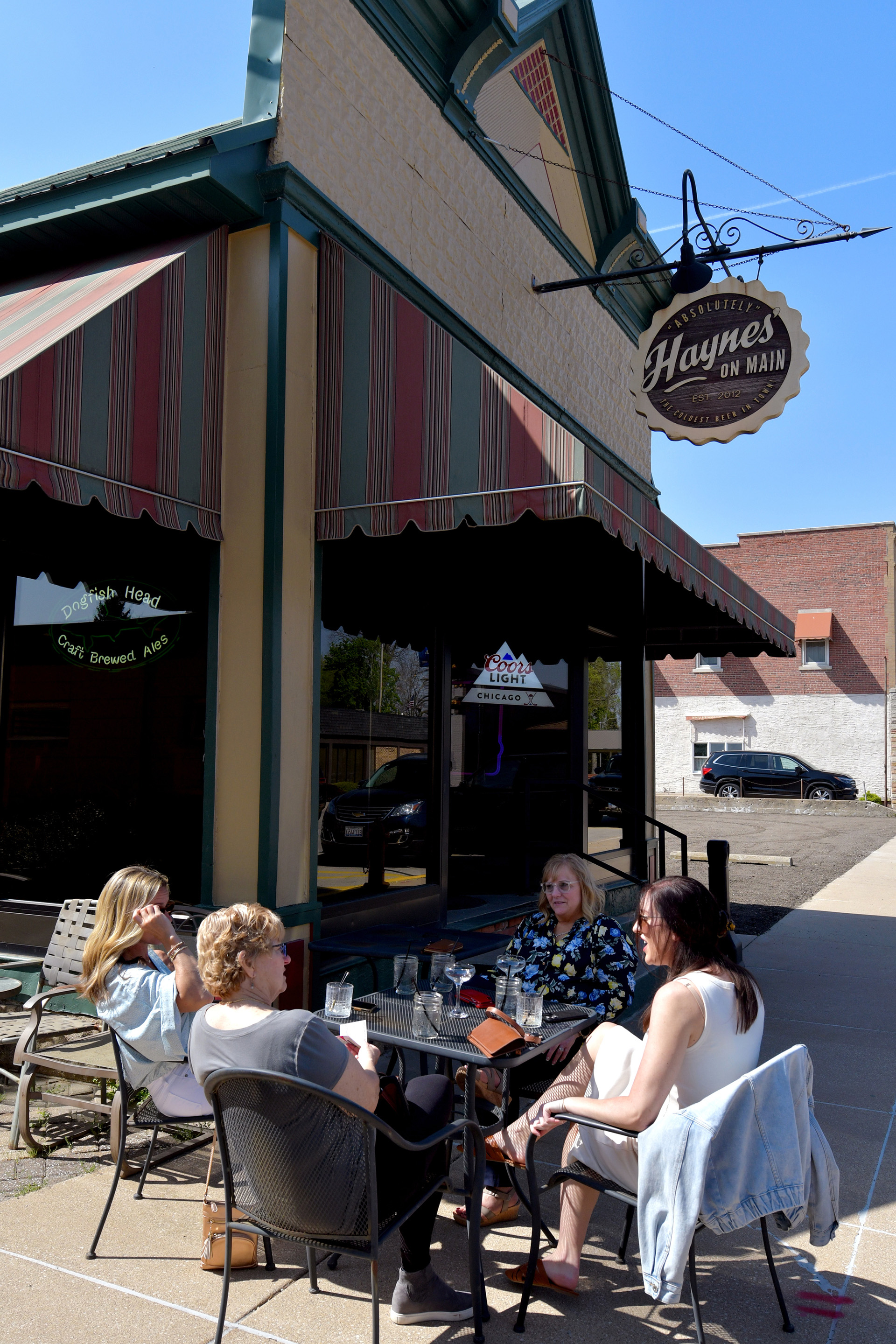 Diners enjoy the day outside Haynes on Main in Mackinaw