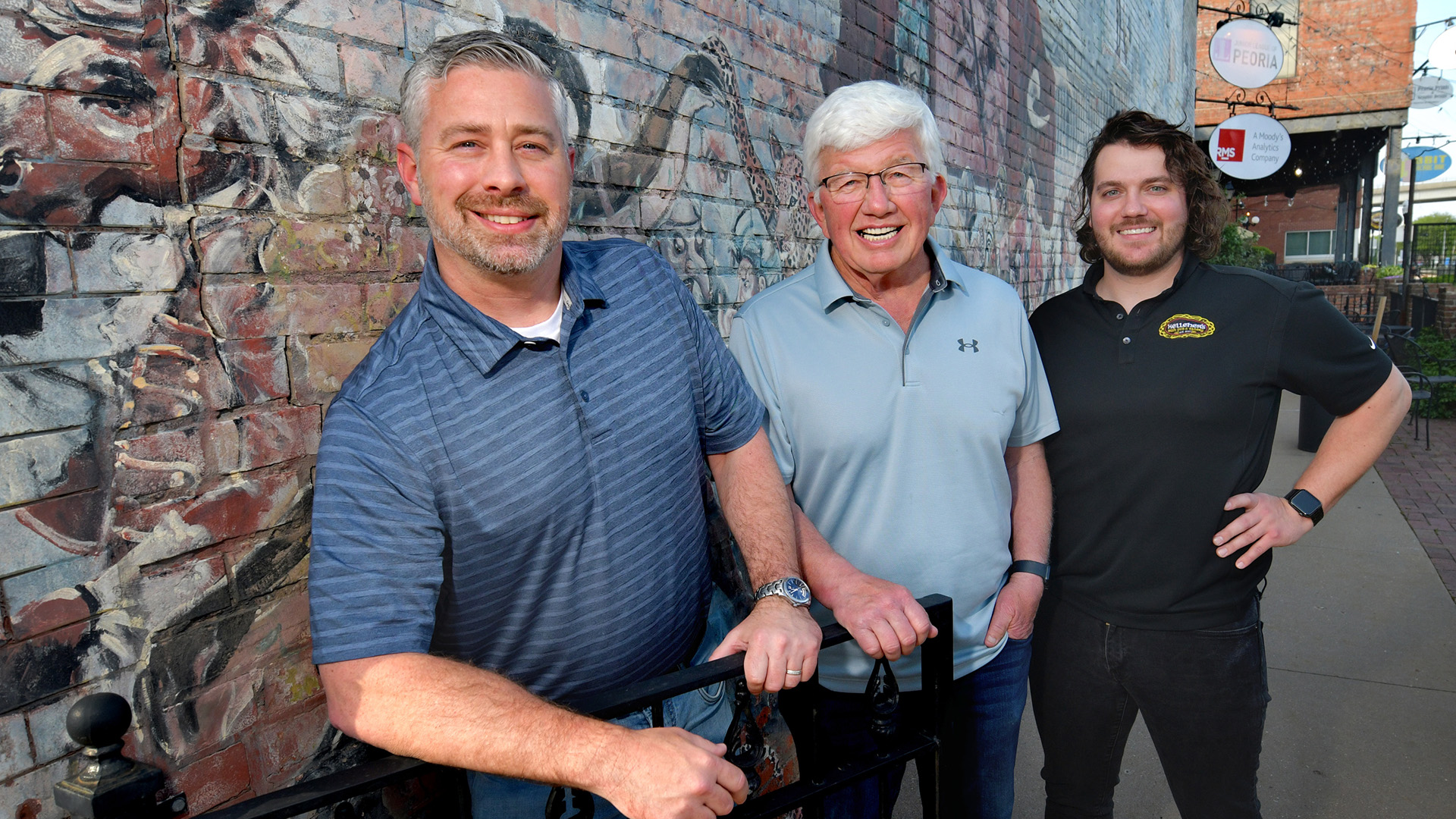 Sean Sullivan, co-owner of Kelleher’s Pub and Eatery at 619 SW Water St. with his father Pat Sullivan, and Paul Maloney, general manager of Kelleher’s, stand near the expanded venue on Water Street for summer concerts