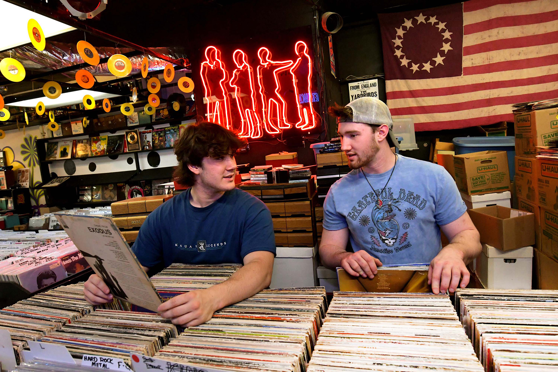 Joe Carmean, left, and his brother Nick shop for vinyl records