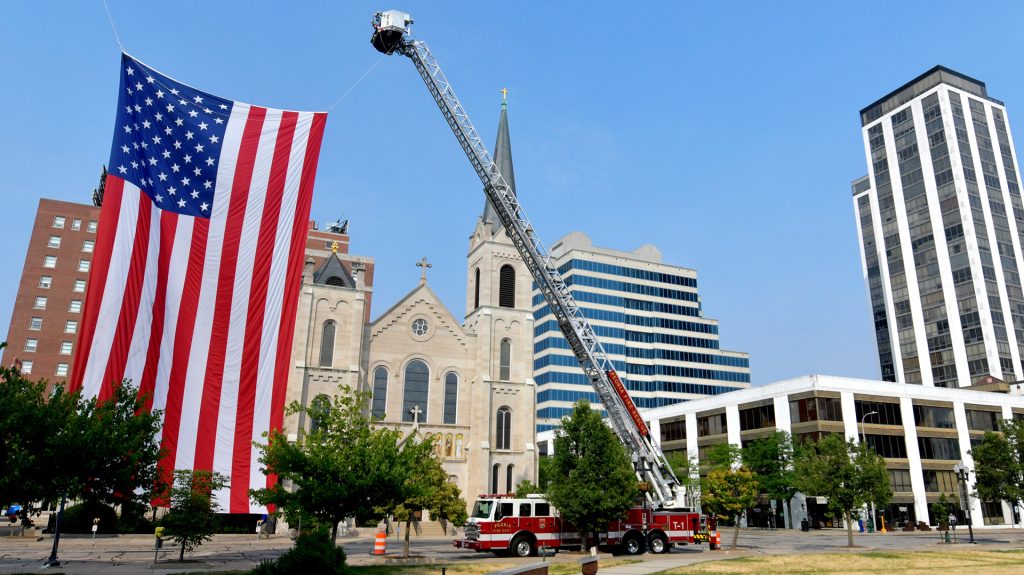 A giant flag is draped near the Peoria Civic Center in recognition of national Flag Day