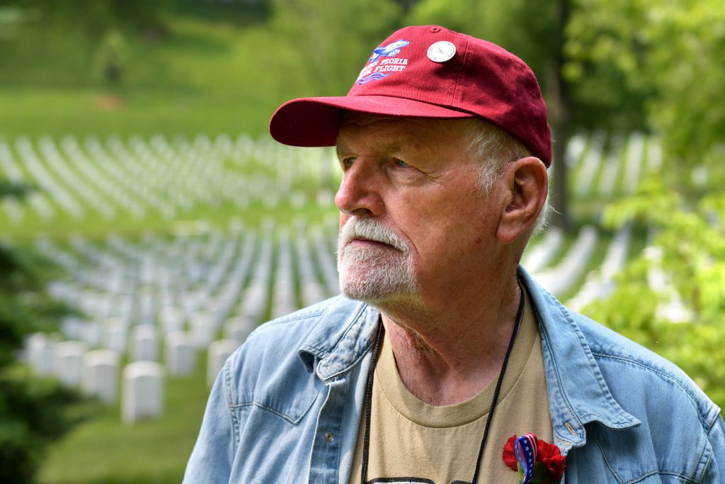 Farrell Lord, a Vietnam War veteran from Metamora, looks over the rows of headstones at Arlington National Cemetery