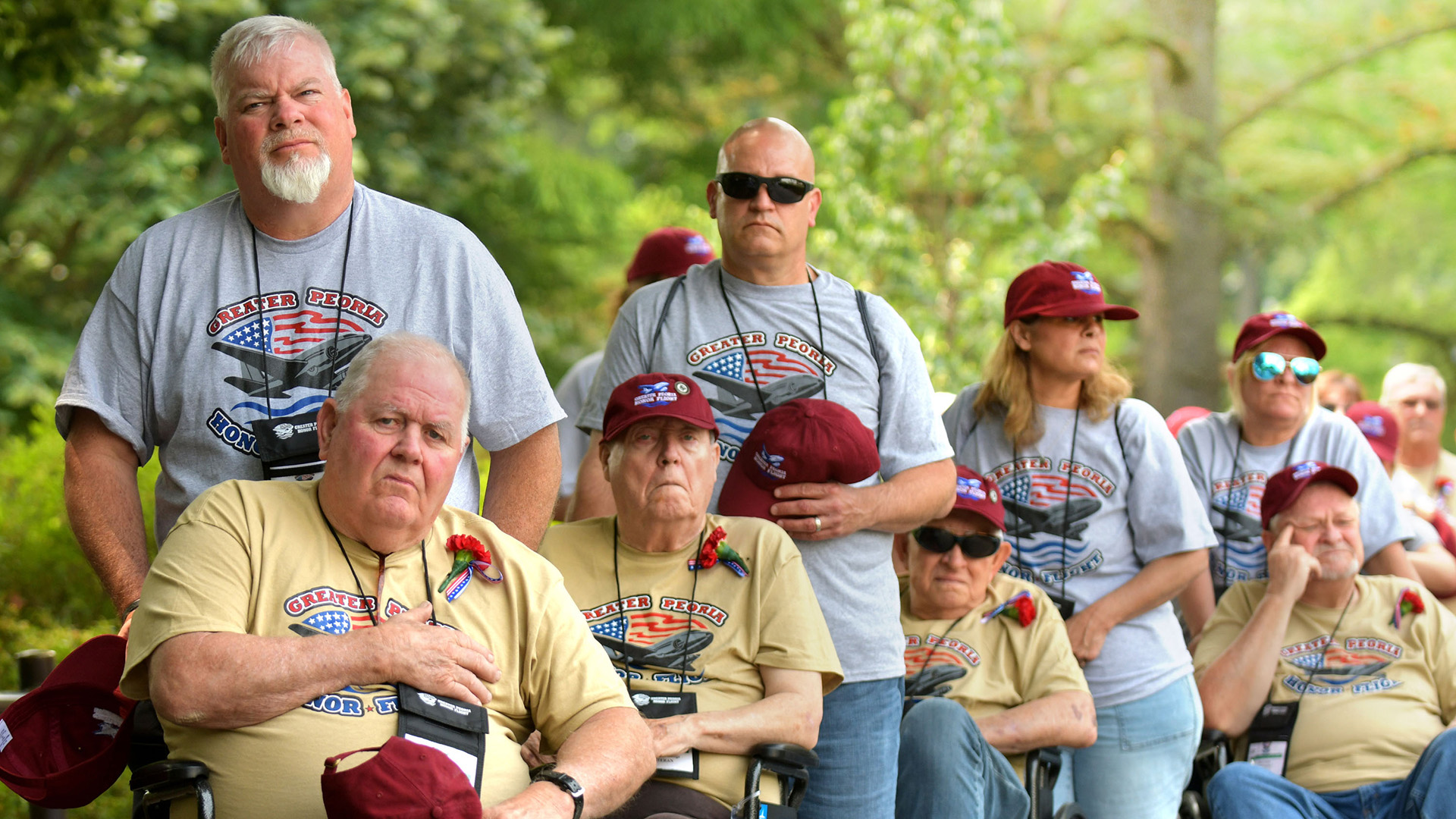 Veterans and their guardians from the Greater Peoria Honor Flight watch during the changing of the guard at Arlington National Cemetery on May 23