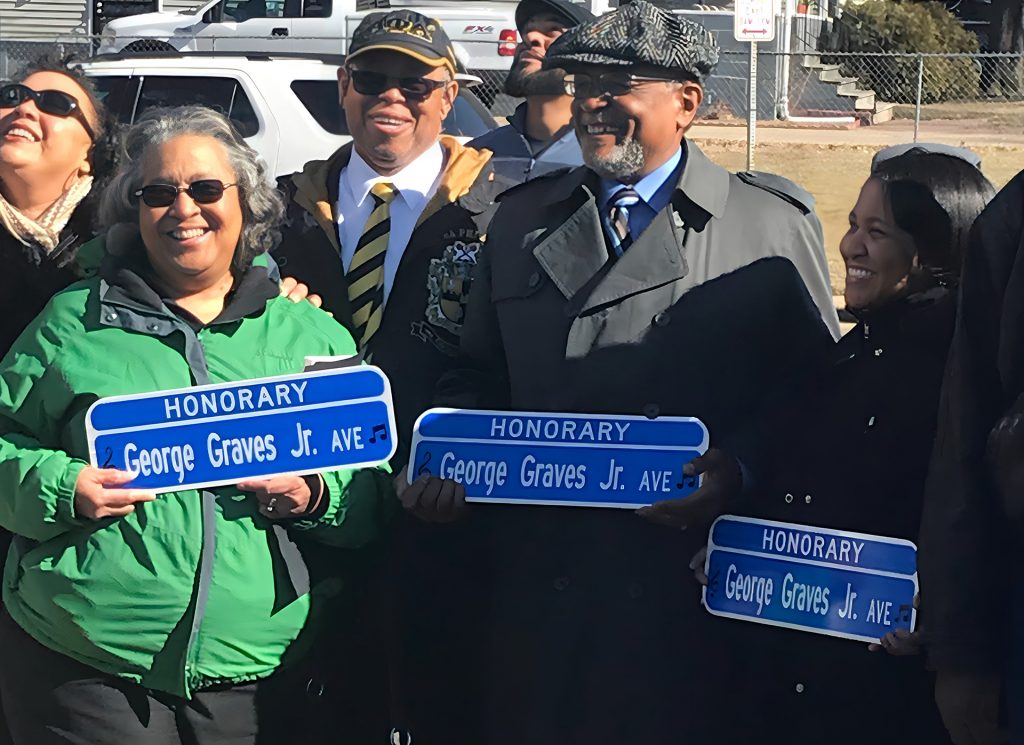 George Graves, second from right, his wife, friends and fans gather in February 2023 at the street renaming ceremony in his honor outside Manual Academy