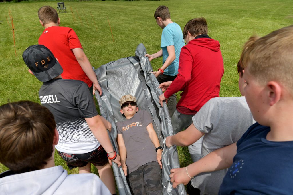 Scouts perform tasks during their weekend campout