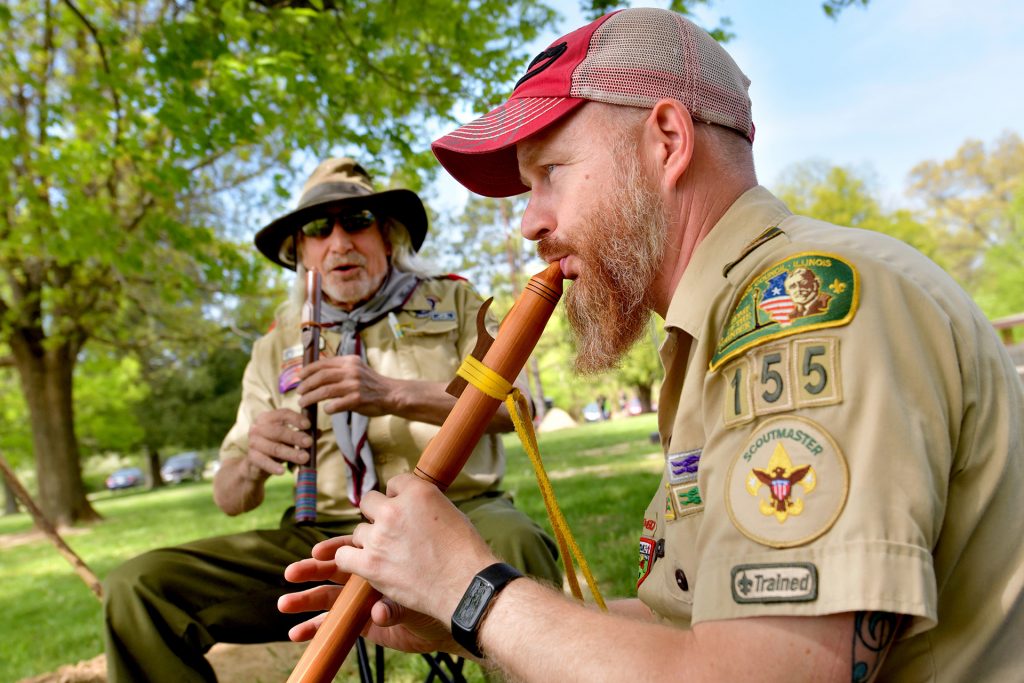 Troop 155 Scoutmasters Eric Hipple (right) and Therry Adcock play wood flutes at the Heartland and Wotamalo Spring Camporee at Sommer Park in Edwards