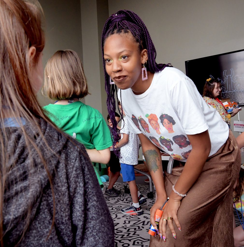 Everley Davis directs a class of students taking part in the Art and Music Camp at the Peoria Riverfront Museum
