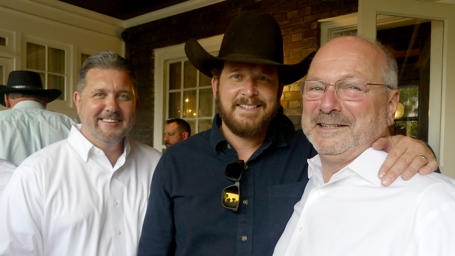 The actor jokes with fundraiser hosts Sid Ruckriegel and Andrew Rand