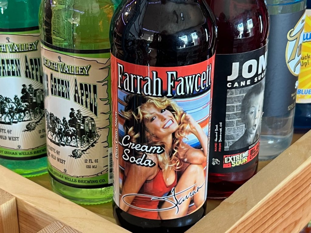 Nostalgia is a big appeal for some of the beverages at the Little Soda Pop Shop, such as this brand and label that mirrors Farrah Fawcett’s famous 1970s poster 