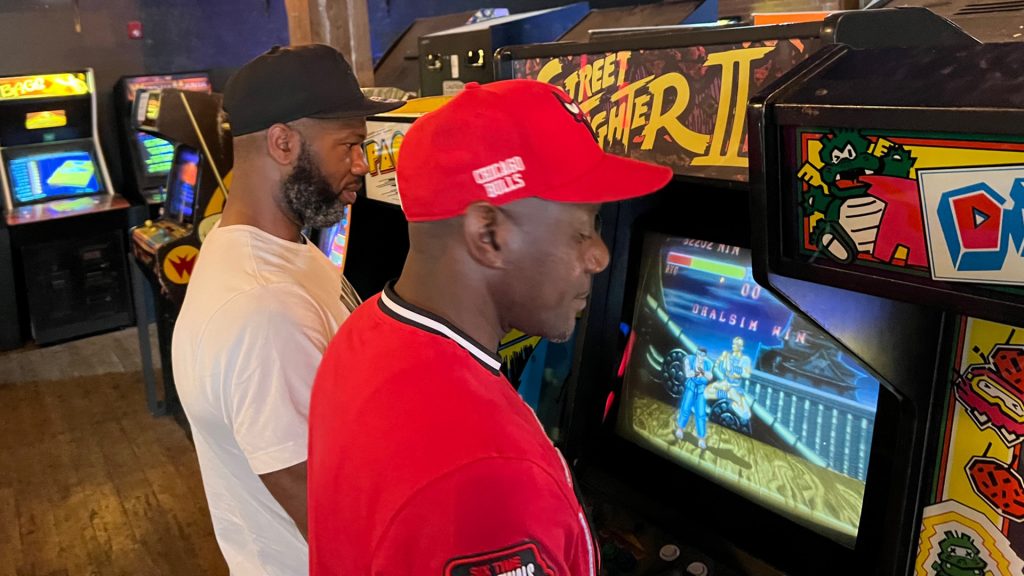 Maurice Whatley (left) and Morris Shields play Street Fighter II at 8 Bit Arcade Bar in Peoria. They’ve been playing video games together since their childhoods on the South Side of Chicago