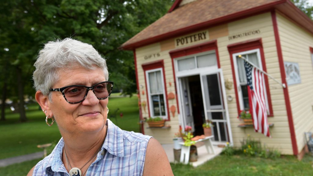Joella Krause, a fifth-generation descendant of the early settlers of Bishop Hill, stands outside of The Potter’s House, where she has some of her photography for sale. Krause is president of the Bishop Hill Old Settler’s Association