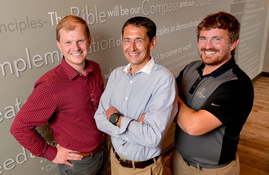 General Manager Bart Rinkenberger (center) with associates Matt Grimm (left) and Keith Grimm at Lighthouse Buick GMC in Morton