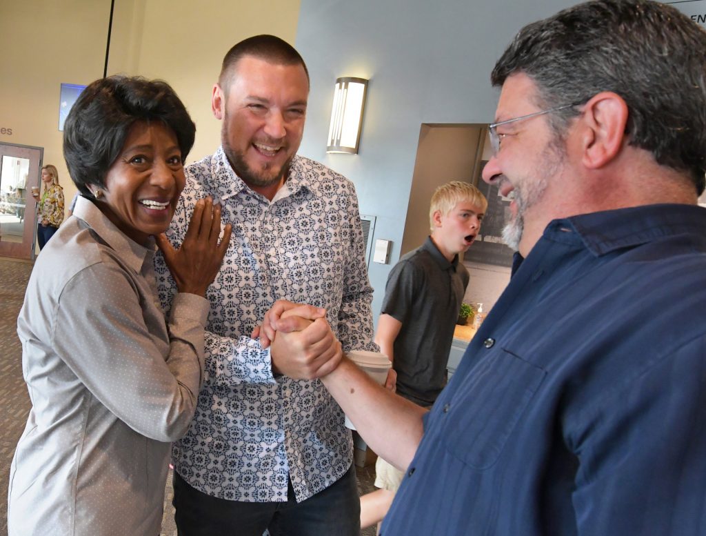 Chad Manbeck, the lead pastor at Richwoods Church, greets parishioners