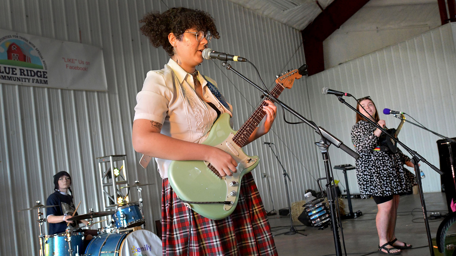 emily the band’s Cami Proctor on guitar performs with members Abbey Haste on drums, left, and Emily Antonacci on ukulele at Three Sisters Park on Sept. 24, 2023